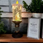 Діва-Марія Декоративна новорічна LED свічка зі снігом, 25см, від батарейок та USB